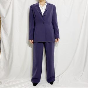Purple suit. Jacket size 12us, trousers 10us.